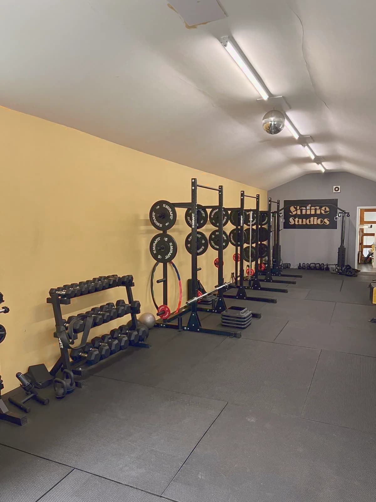 Inside Shine Studios in Shedfield, with weights, training racks and space to exercise